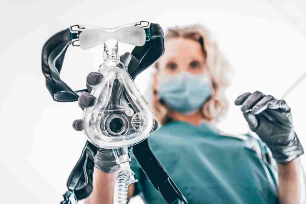 anesthetist-readying-oxygen-mask-in-clinical-setting